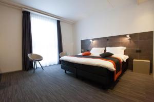 Voodi või voodid majutusasutuse Hotel Vé toas