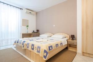 Vila Mitrovic tesisinde bir odada yatak veya yataklar