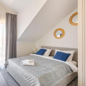 Ένα ή περισσότερα κρεβάτια σε δωμάτιο στο Silver Apartamenty