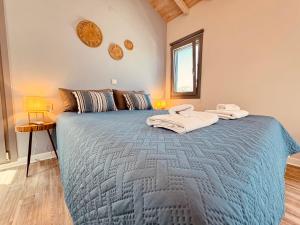 En eller flere senge i et værelse på Kenezakia houses