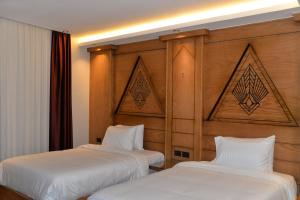 Voodi või voodid majutusasutuse Neom Pyramids Valley Boutique hotel toas
