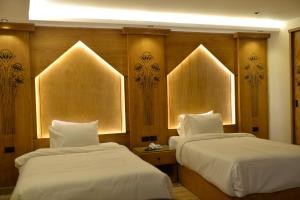 Voodi või voodid majutusasutuse Neom Pyramids Valley Boutique hotel toas