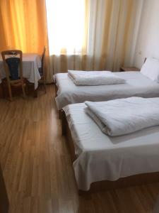 Postel nebo postele na pokoji v ubytování Pensiunea Residence