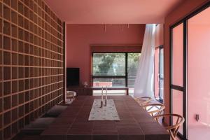 a dining room with a table and chairs and a window at AKTI SEASIDE SUiTES in Preveza