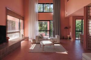 a living room with a couch and a chair at AKTI SEASIDE SUiTES in Preveza