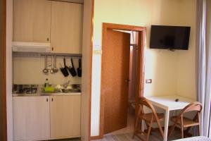 Kuchyň nebo kuchyňský kout v ubytování Residence Rosa
