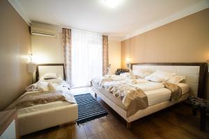 Postel nebo postele na pokoji v ubytování Hotel Zenubia