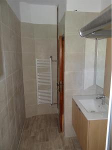 a bathroom with a sink and a mirror at Kalogeriko in Polychrono +22 photos