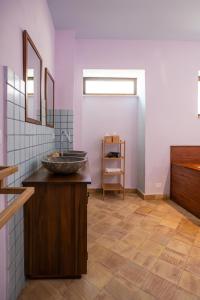 a bathroom with a stone sink on a counter at Villa Amoroso - Ospitalità Mediterranea in Agrigento +130 photos