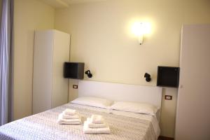 Postel nebo postele na pokoji v ubytování Residence Rosa