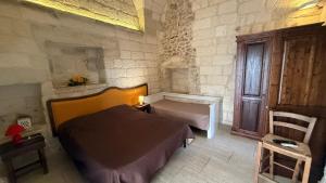 a small bedroom with a bed and a window at Sunset affittacamere in Cannole