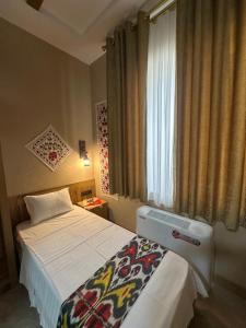 Hotel Byond Khiva客房内的一张或多张床位