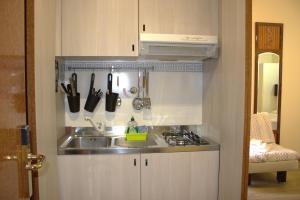 Kuchyň nebo kuchyňský kout v ubytování Residence Rosa + 37 fotografií