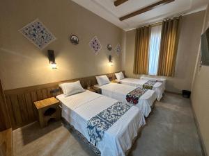 Hotel Byond Khiva客房内的一张或多张床位