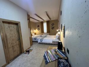 Hotel Byond Khiva客房内的一张或多张床位