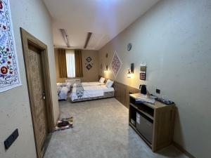 Hotel Byond Khiva客房内的一张或多张床位
