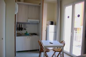 Kuchyň nebo kuchyňský kout v ubytování Residence Rosa