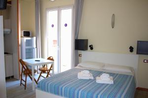 Postel nebo postele na pokoji v ubytování Residence Rosa