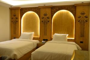 Voodi või voodid majutusasutuse Neom Pyramids Valley Boutique hotel toas
