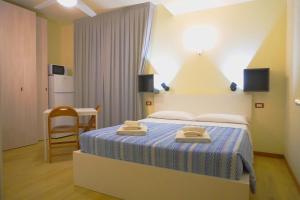 Postel nebo postele na pokoji v ubytování Residence Rosa