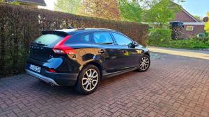 a black car parked on a brick driveway at Ferienwohnung "Friesentied" 35229 in Hesel