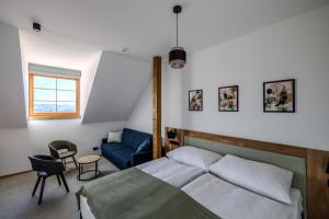 Postel nebo postele na pokoji v ubytování Resort Vysoká Lípa
