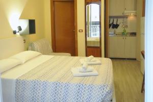 Postel nebo postele na pokoji v ubytování Residence Rosa