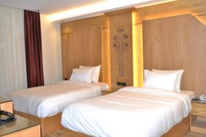 Voodi või voodid majutusasutuse Neom Pyramids Valley Boutique hotel toas