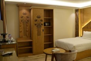 Voodi või voodid majutusasutuse Neom Pyramids Valley Boutique hotel toas