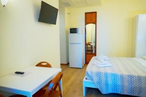 Postel nebo postele na pokoji v ubytování Residence Rosa
