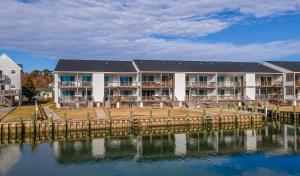 a resort on the water with a dock at Wonderview 208 in Birch Town