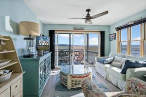 a living room with a couch and a table at Wonderview 208 in Birch Town +30 photos