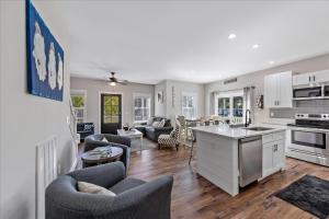 a kitchen and living room with a kitchen and a living room at Saltwater Pony in Black Point Landing