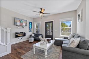 a living room with a couch and a table at Saltwater Pony in Black Point Landing