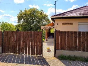 an entrance to a house with a wooden gate at Gárdonyi Ház in Sály +31 photos