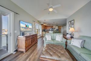 a living room with a couch and a tv at Sunset Bay Villa 319 - Bella Vista in Chincoteague