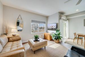 a living room with a couch and a table at Ducks, Docks, And Flip Flops in Chincoteague