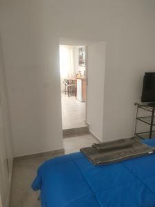 Televízia a/alebo spoločenská miestnosť v ubytovaní Casa Alba 1