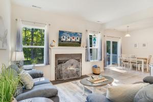 a living room with couches and a fireplace at The Shore Shanty in Greenbackville