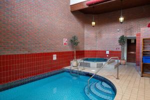 a large swimming pool in a brick building at The Royal Lion Hotel in Lyme Regis