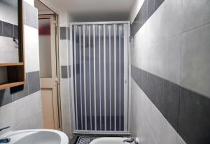 a bathroom with a toilet and a radiator at REGINA ELENA Loft & Room by Tufaro b&b in Macerata Campania +99 photos