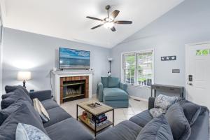 a living room with a couch and a fireplace at 36 Rabbit Run Lane in Ocean Pines