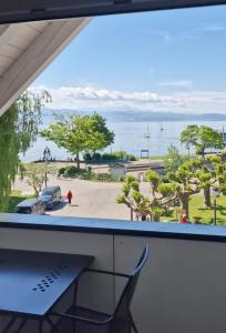 a view of the ocean from a window at Hotel Klett B&B in Langenargen
