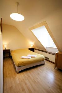a bedroom with a bed and a large window at Maison du GR34 Baie de Beaussais Classée 1 étoile in Beaussais sur Mer