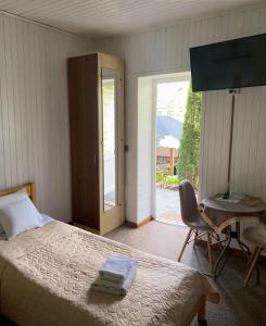 Postel nebo postele na pokoji v ubytování Zorianyy Guest House + 37 fotografií