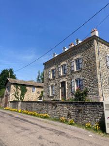 an old stone house on the side of a road at Bourgeoisie @ Brandon in Brandon