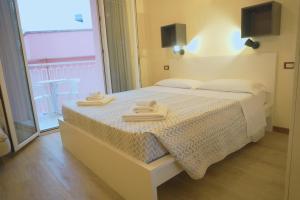 Postel nebo postele na pokoji v ubytování Residence Rosa