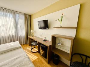 Postel nebo postele na pokoji v ubytování ARVENA Messe Hotel