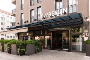 a building with a new berlin sign on it at Hotel NEWBERLIN in Berlin +30 photos