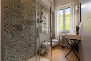 a bathroom with a shower with a toilet and a sink at Lavarell - 10 minuti dal centro in Como